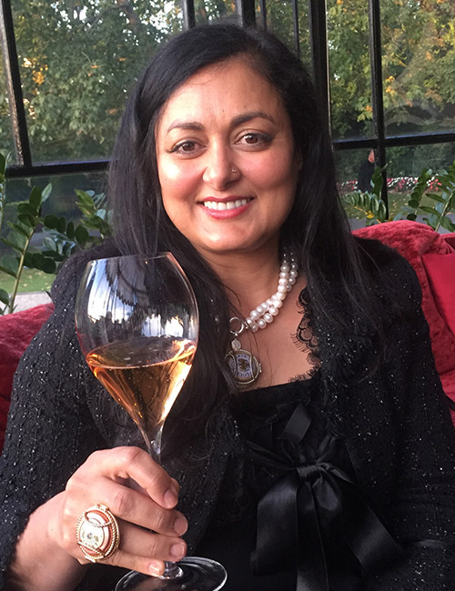 Kiron Barui Holding a Wine Glass