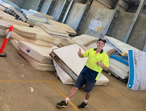 taylor's team organising matress for recycling